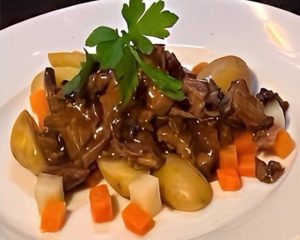 Slow-cooked lamb shanks infused with Irish whiskey, garlic and rosemary served with colcannon